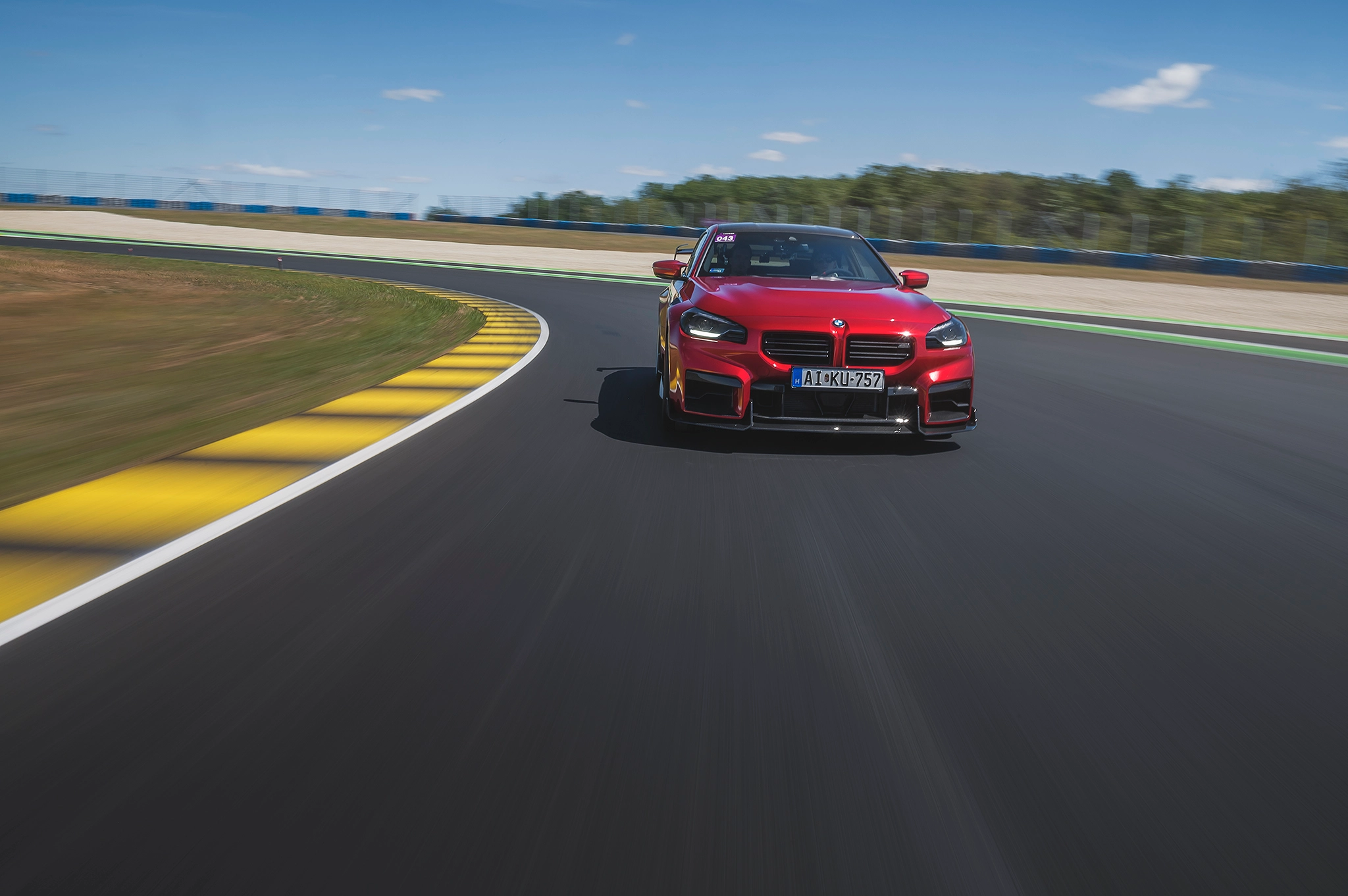 Red BMW cornering on track